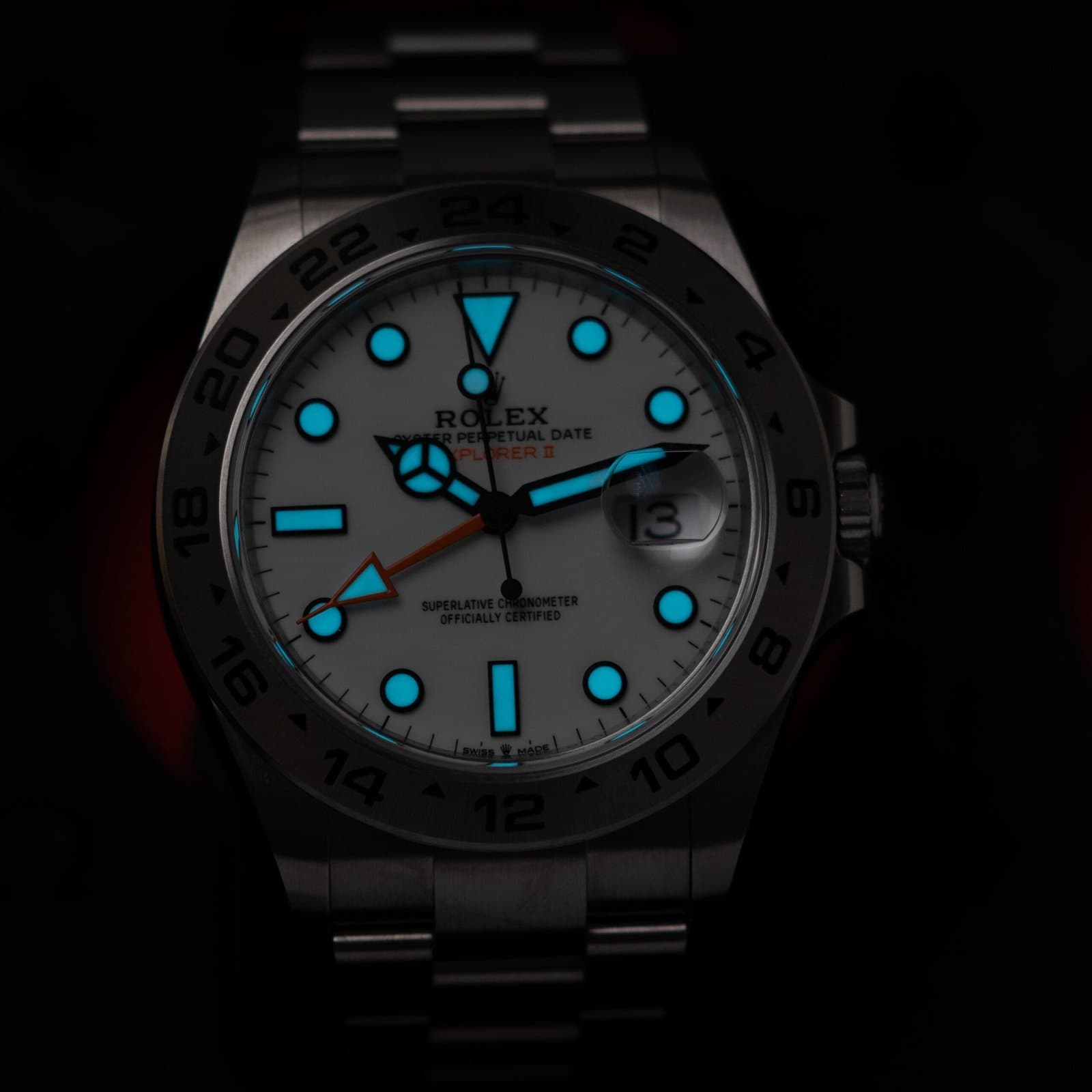 Rolex Explorer II with its luminous dial glowing in low light