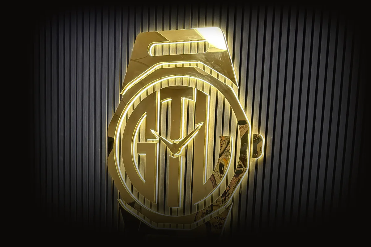 The lit Good Times Luxury sign in the private office suite in Naperville