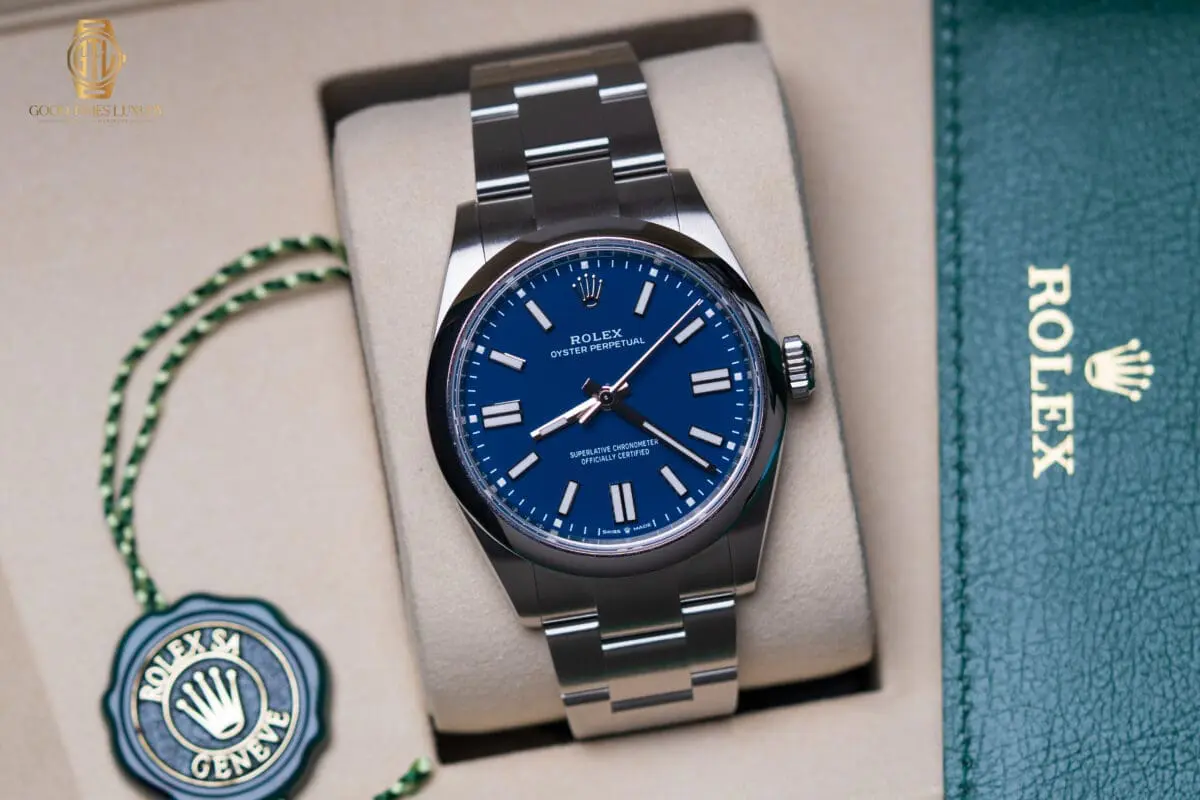 Rolex Oyster Perpetual stainless steel watch with blue dial on Oyster bracelet displayed in box