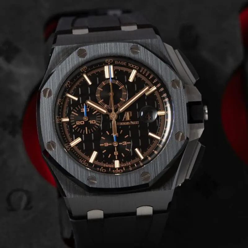 Audemars Piguet Royal Oak Offshore Chronograph — black dial with rose gold accents, stainless steel case, and rubber strap