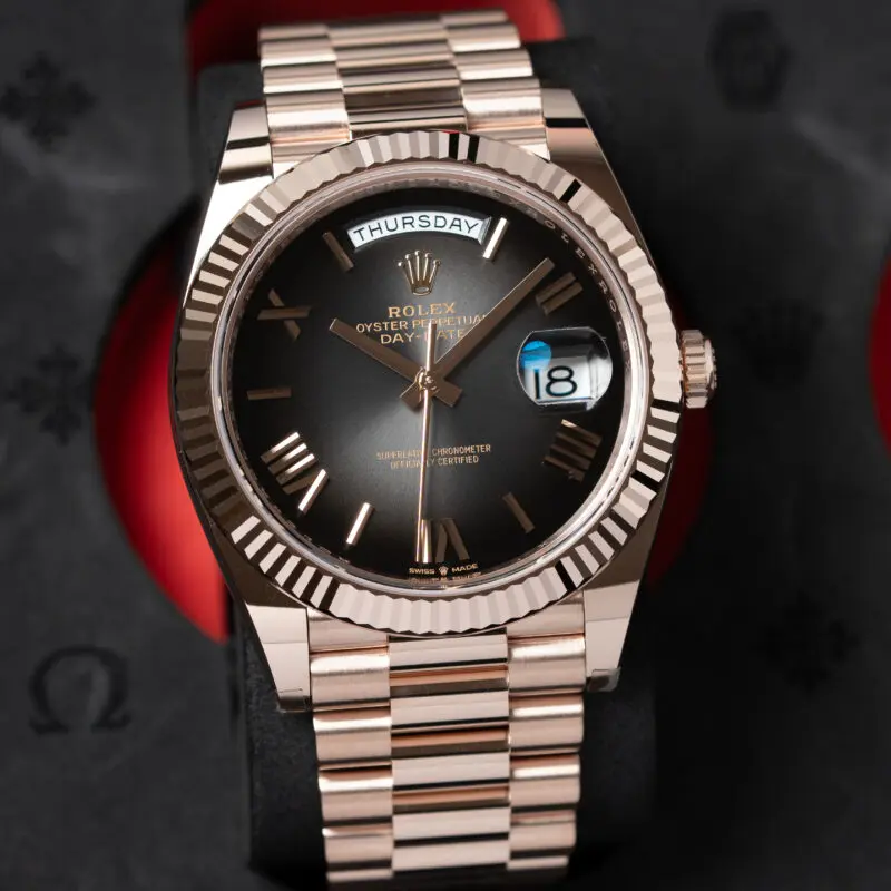 Rolex Day-Date 40 in Everose gold with chocolate dial on President bracelet showing Thursday 18