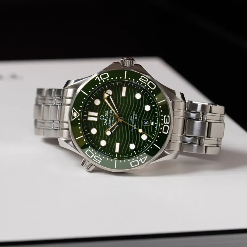 Omega Seamaster with a dark green dial and bezel — shown as a real-world example for buyers evaluating Omega price predictions 2026 and value retention.
