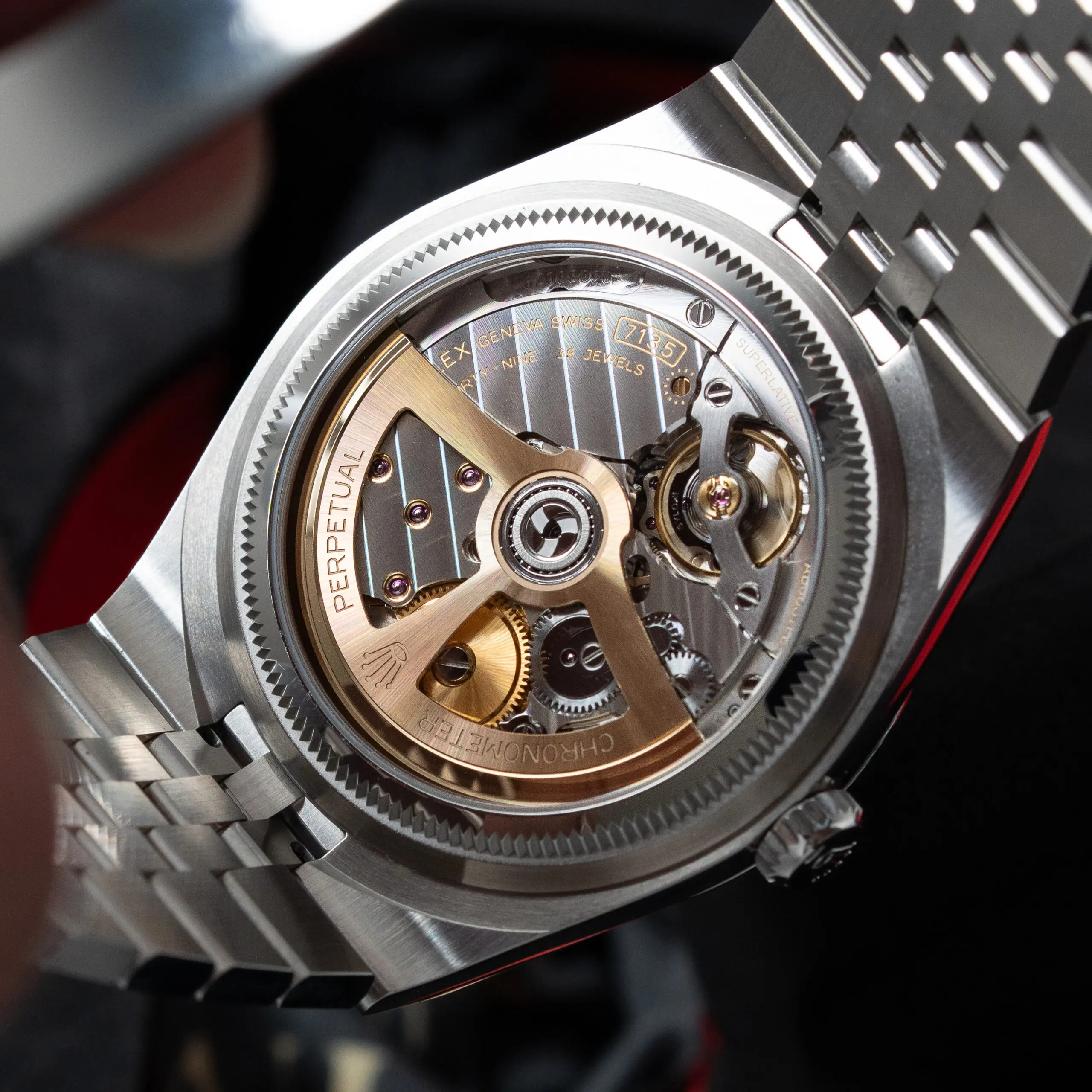 Rolex Land Dweller watch caseback close-up showing the movement and bracelet