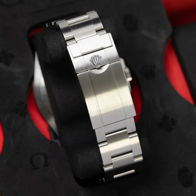Back of Rolex Explorer II Oyster bracelet clasp showing engraved Rolex coronet and brushed stainless steel finish