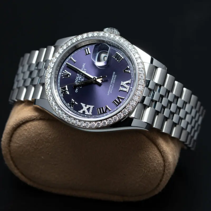 Rolex Datejust with purple dial and diamond bezel on jubilee bracelet close-up